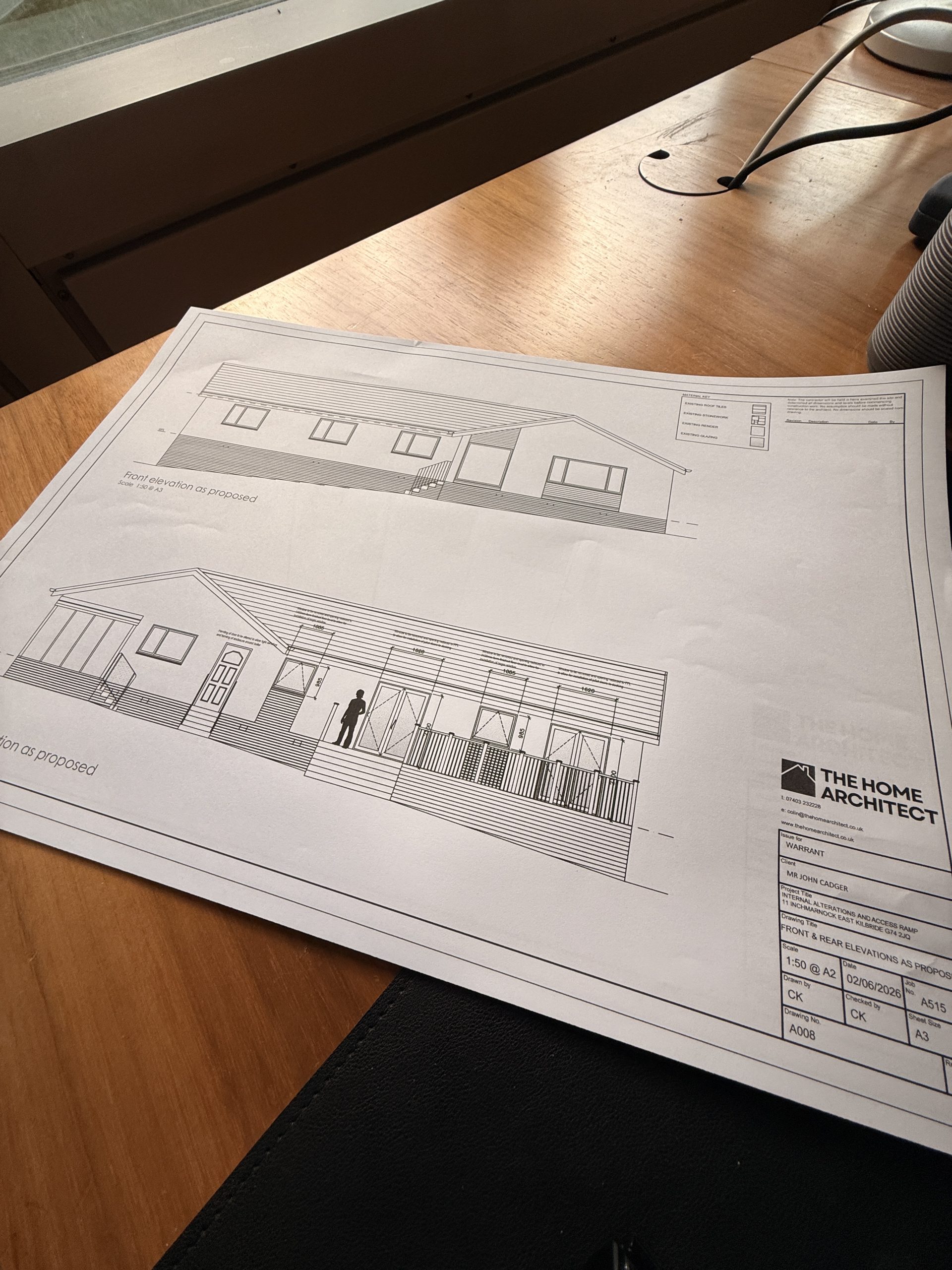 Architect cost calculator Scotland - reviewing house extension plans